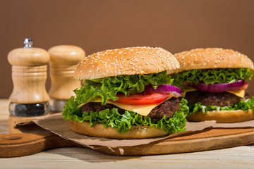 burgers on wooden table
