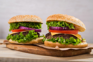 burgers on wooden table