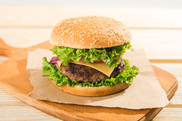 burgers on wooden table