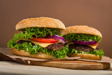 burgers on wooden table