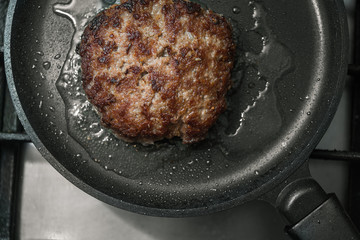 burger cutlet on metal pan