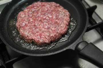 burger cutlet on metal pan
