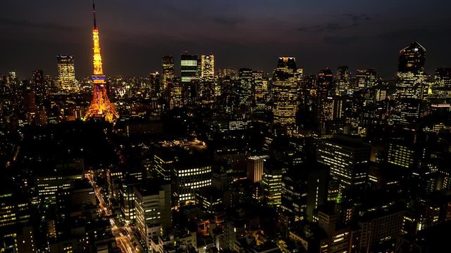 Night Tokyo city view with glowing Tokyo Tower. 4K resolution time lapse zoom in. June 2016