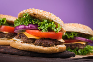 burgers on wooden table