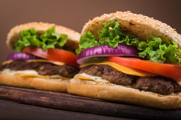 burgers on wooden table