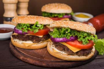 burgers on wooden table