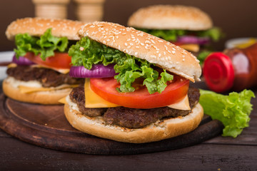 burgers on wooden table