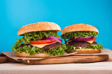 burgers on wooden table