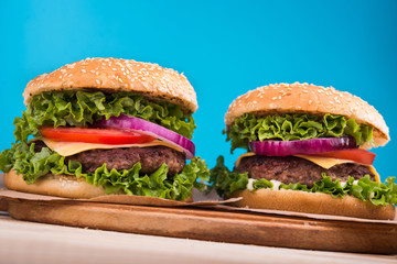 burgers on wooden table