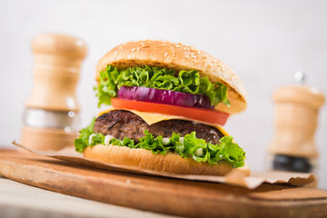burgers on wooden table