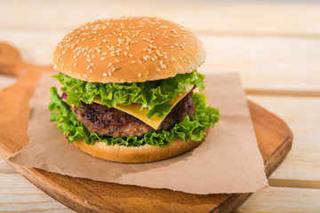 burgers on wooden table