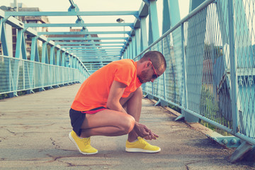 Tying running shoes.