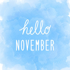 Hello November greeting on abstract blue watercolor background