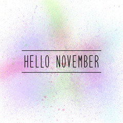 Hello November text on pastel spray paint background