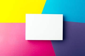 Business card blank over colorful abstract background.