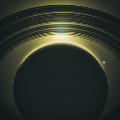 Fototapeta premium planet saturn with rings at sunrise on the space background 