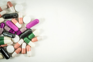 Heap of medicine pills isolated on white background.