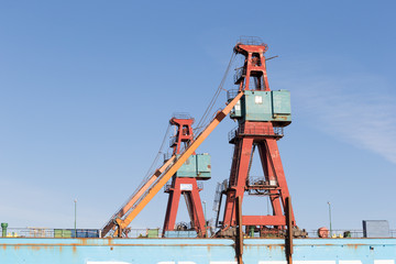 Fototapeta na wymiar Old cranes and dry dock in Göteborg