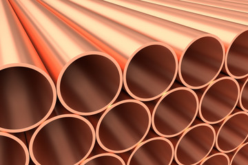 Shiny copper pipes in rows