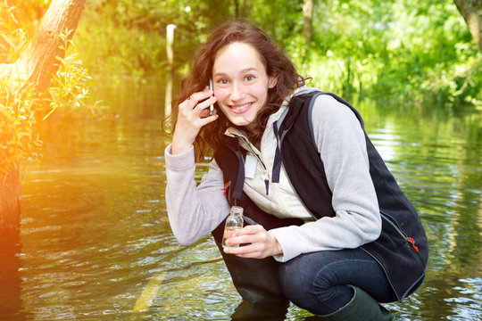 Young attractive biologist woman working on water analysis