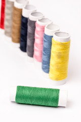 Colorful threads on the white background