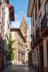 Fototapeta premium Mon street in Oviedo downtown, with the Cathedral tower in the background