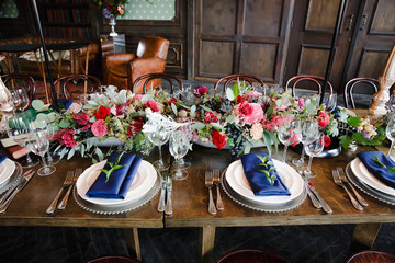 A look from above on an aristocratic served dinner table with hu