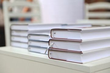 a stack of books on a  table