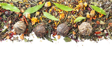 Assortment of dry tea on white background