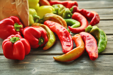 Fresh peppers on wooden table