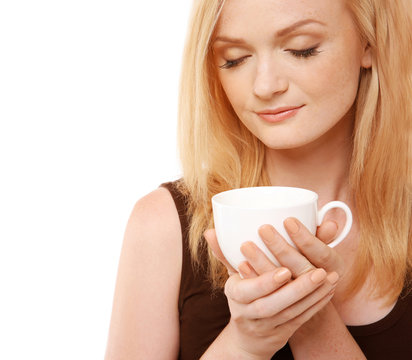Beautiful girl with cup of coffee on white background