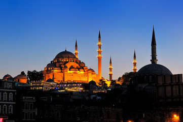 Fototapeta na wymiar Night view of the Muslim mosque and minarets