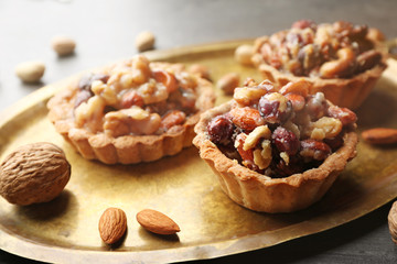 Tasty tart cakes on tray