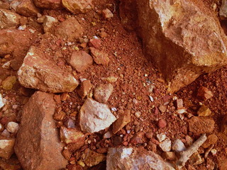 pile of brown-red rocks and stones