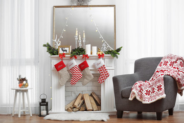 Living room with beautiful fireplace decorated for Christmas