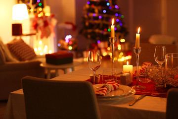 Close up view of table served for Christmas dinner, on blurred background