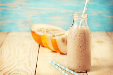 melon  smoothie in a glass bottle