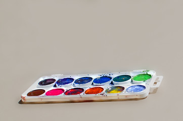 Used water-color paint-box with gray background