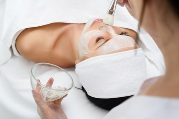 Sensual girl enjoying healthy mask at spa