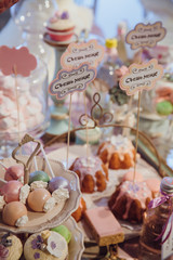 Cakes with letterint 'Eat me' stand on the plate