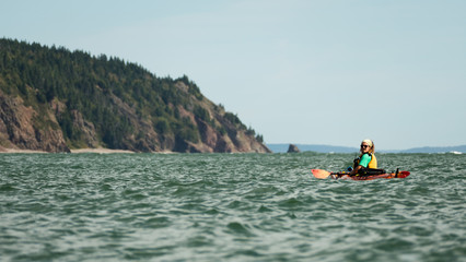 Man kayaking on sea