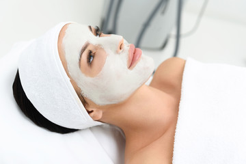 Serene girl enjoying skin care treatment