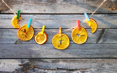 Dried oranges on a wooden background