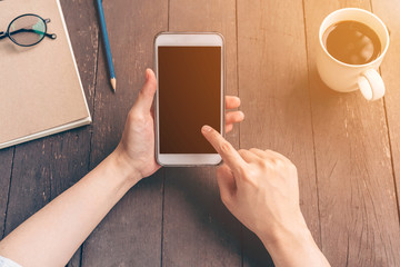 Close up hand asia woman using phone in coffee shop with vintage