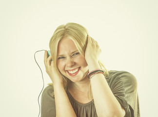 Pretty blond woman listening to music