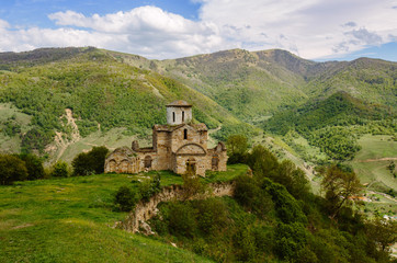 Fototapeta na wymiar The early Christian Church in the mountains (North Caucasus, Russia). Sentinsky temple. Karachay-Cherkess Republic (Karachay-Cherkessia)