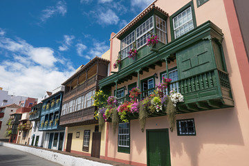 Famous ancient colorful colonies balconies decorated with flower © herraez