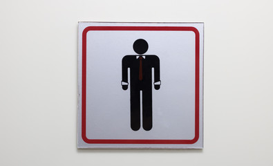 Signs to the toilet with a dim light.