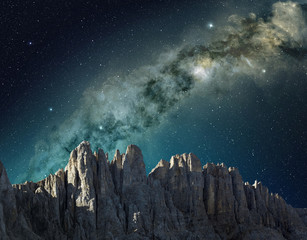 milky way in the sky above the mountain ridge