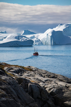 A boat in the icefjord of Ilulissat, Greenland